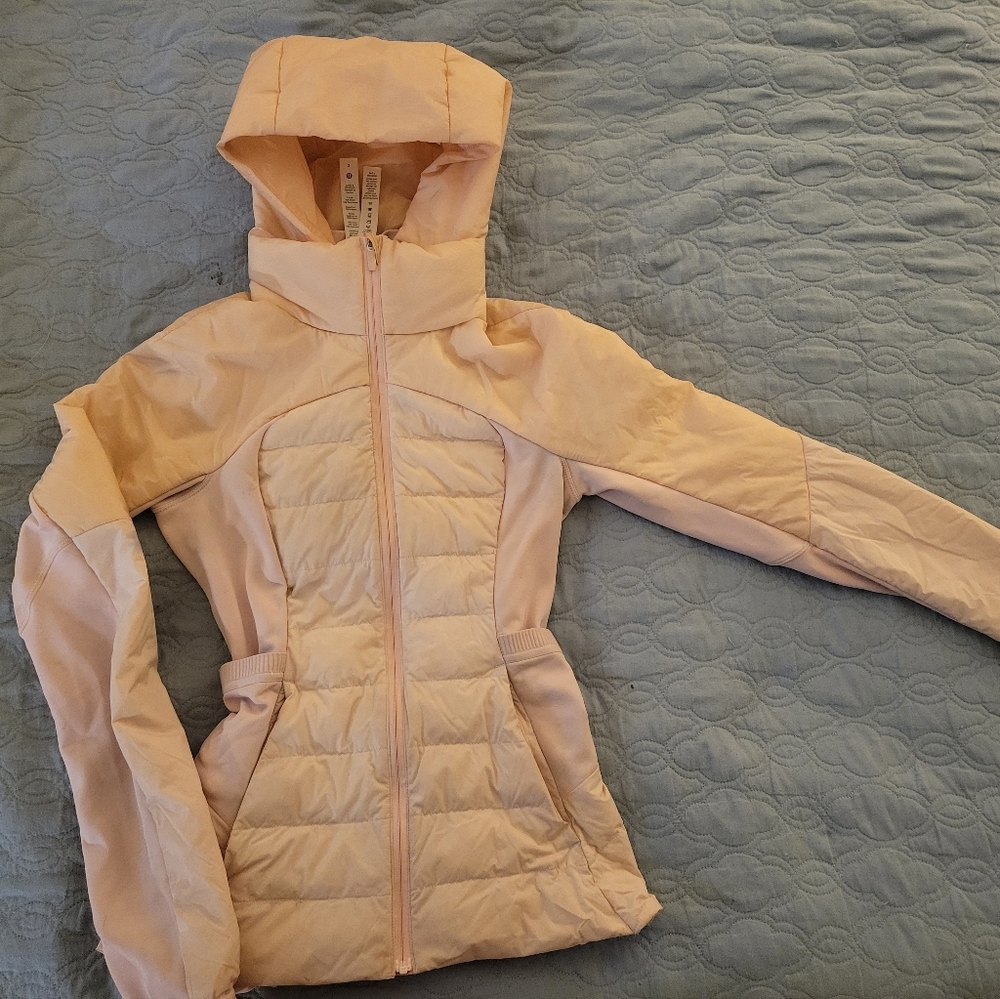 A baby pink Lululemon spring jacket